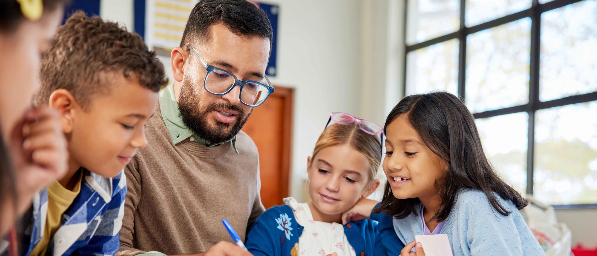 teacher working with students